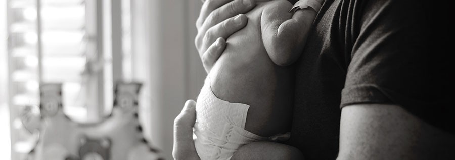 Father holding baby Father holding baby